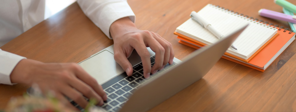 Man typing on a laptop